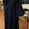 عباية سوداء بتفاصيل كشكش صدفية ناعمة - "عبايه نمبر ون" - لمسة أنثوية رقيقة